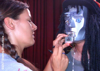 Illustration for article titled Britney Spears Battles Batman's Gay Robots